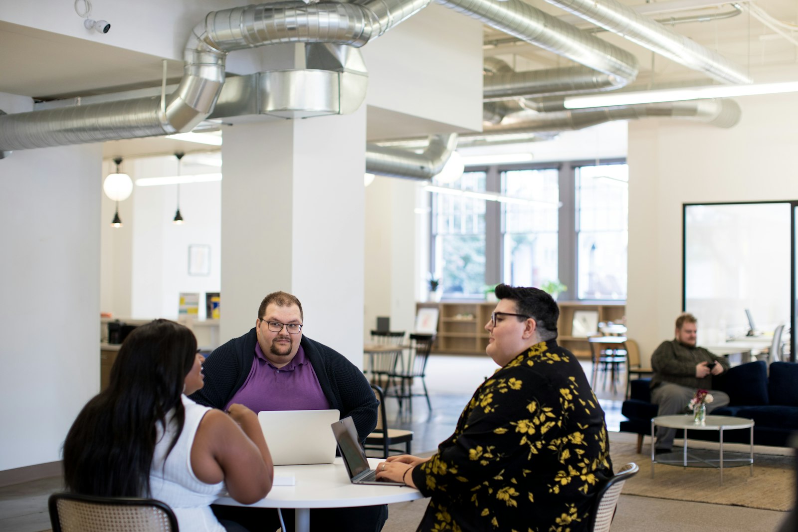 Legal adviser speaking with a client across a desk